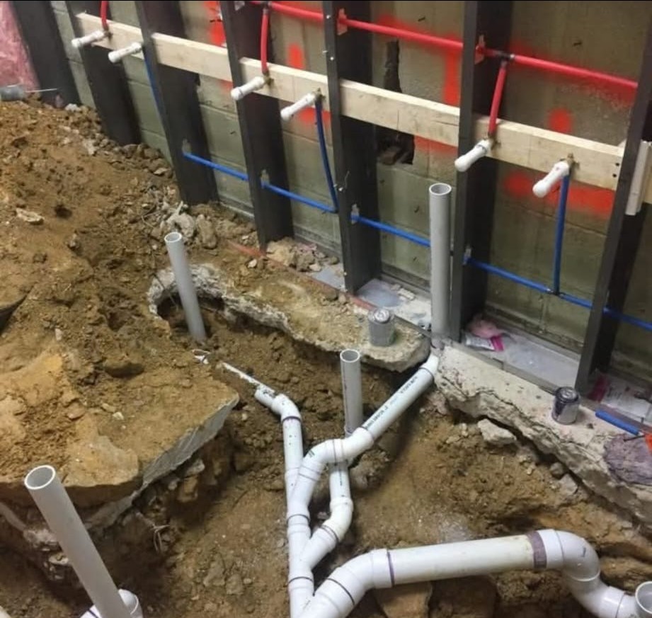 Excavation opened for underground plumbing work