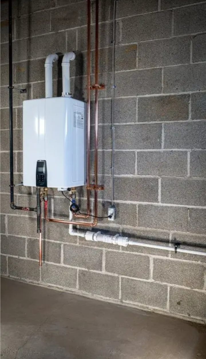 Completed water heater installation with new connections